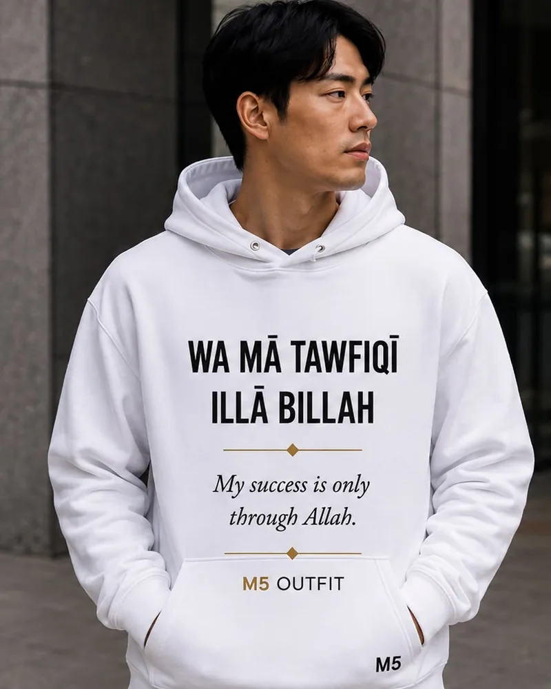 Model wearing a white M5 Outfit hoodie printed with the Arabic and English phrase Wa Ma Tawfiqi Illa Billah