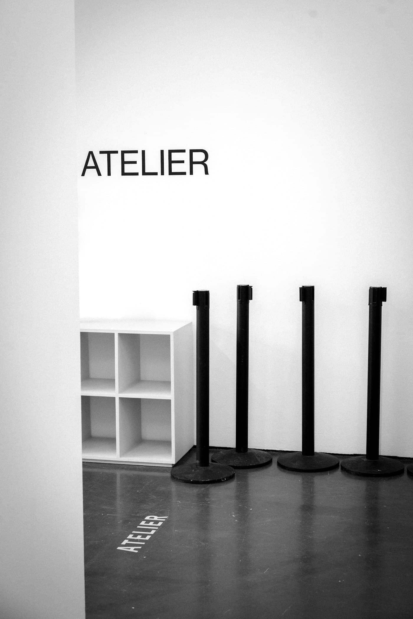 Minimalist M5 Outfit studio space with an 'Atelier' sign
