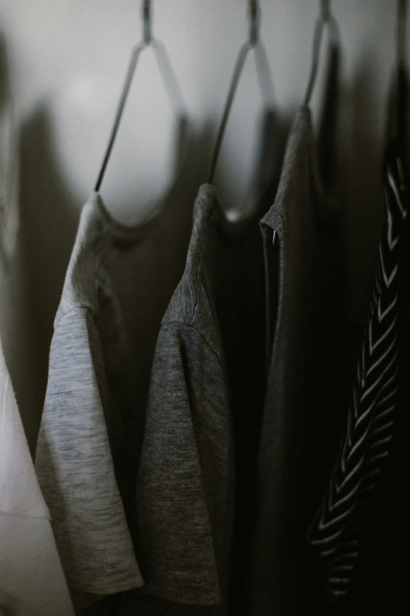 Close-up detail of M5 Outfit garments hanging, showing fabric and construction