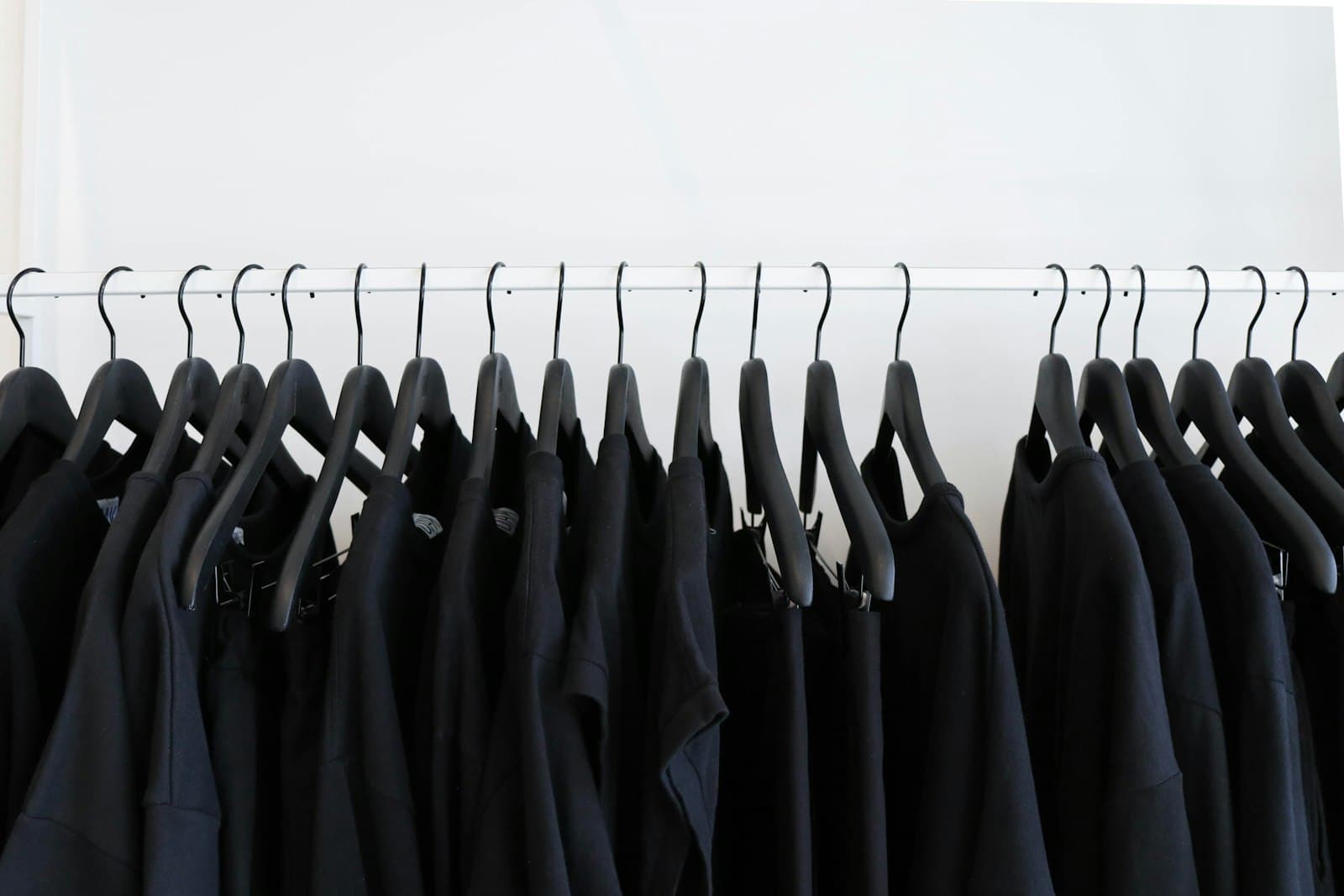 A full rack of black M5 Outfit garments